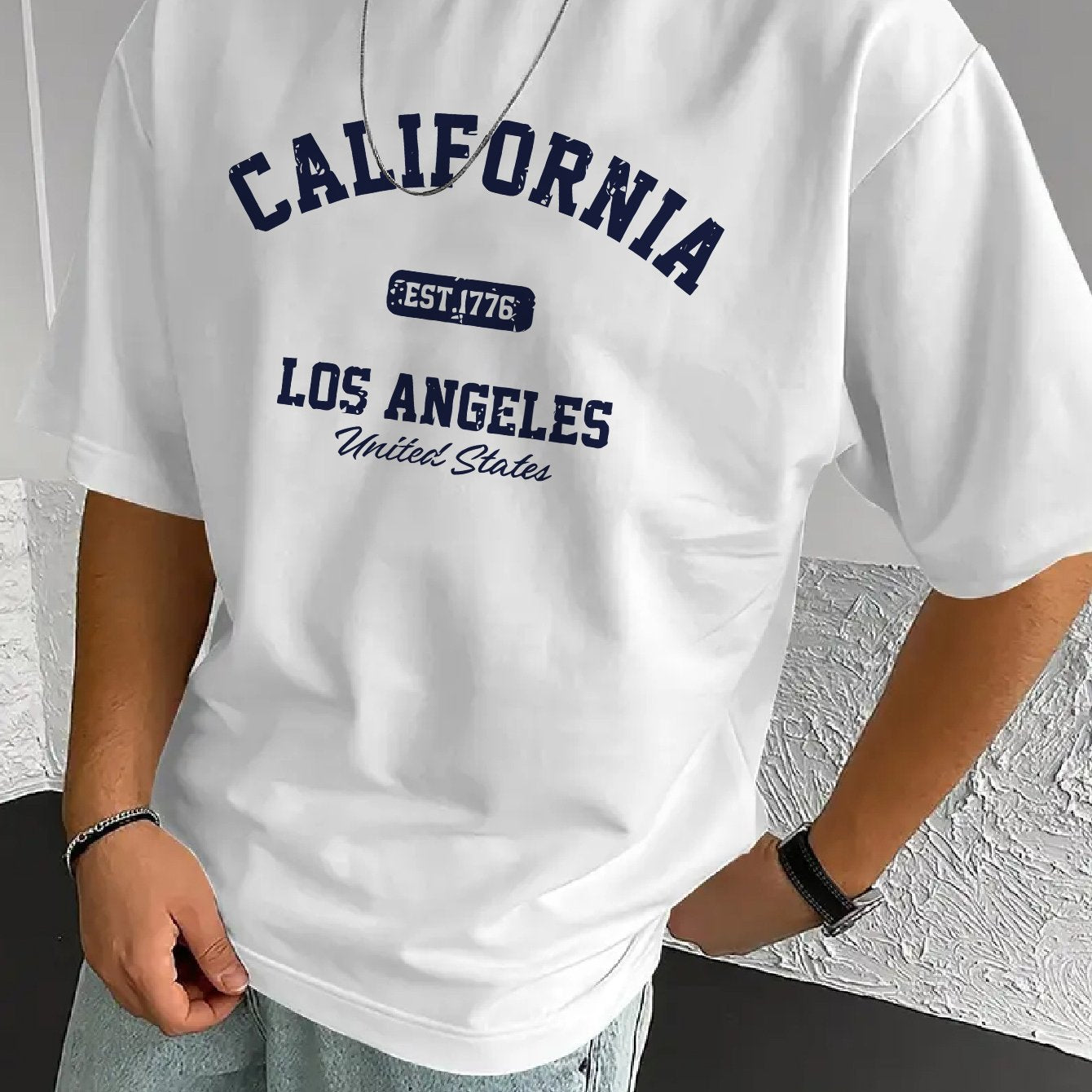 A Stylish Loose-Fitting White T-Shirt for Men with a Trendy Letter Print, Perfect for Casual Wear.